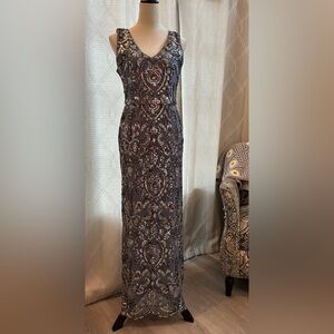Adrianna Papell sleeveless, high neck, hand- sequined gown.